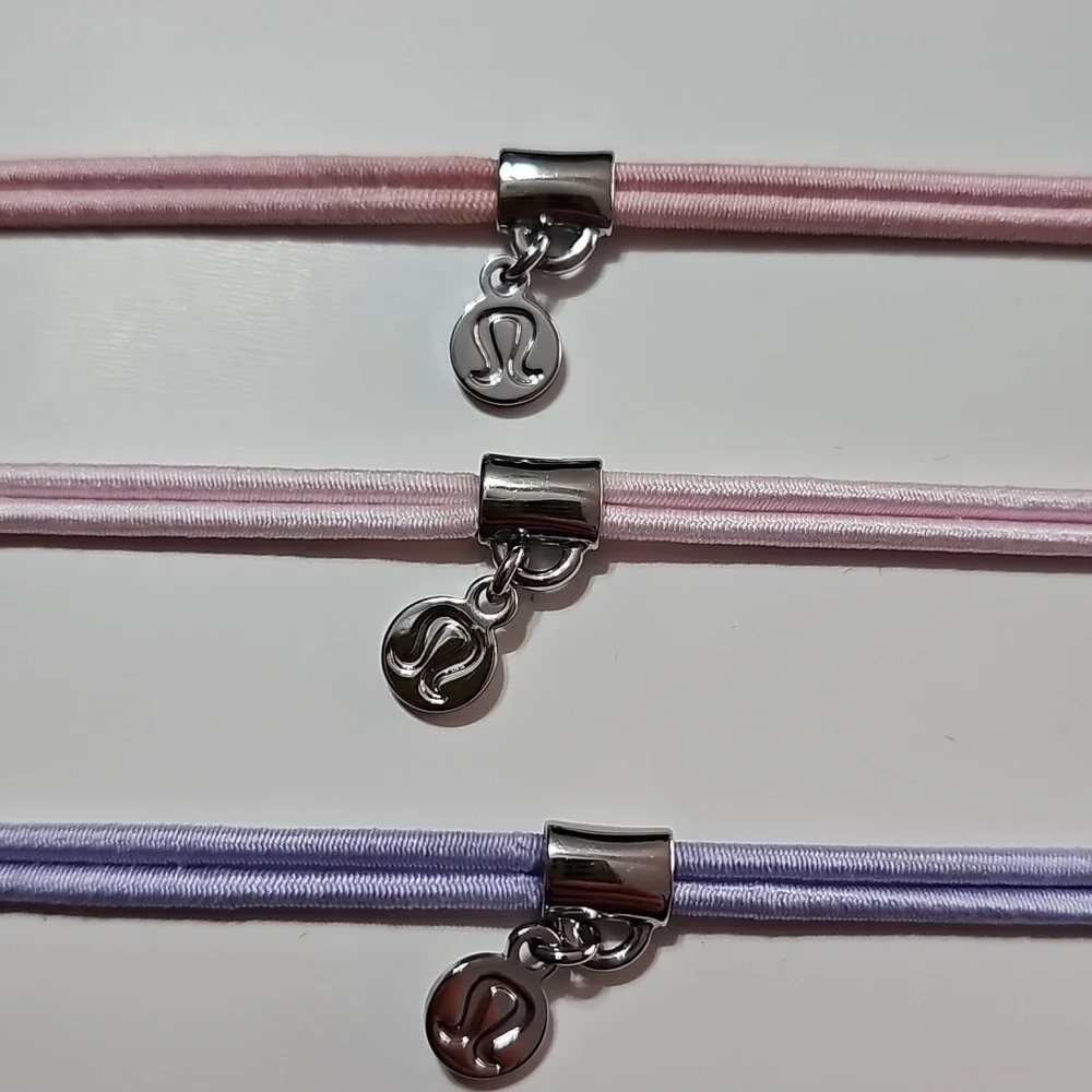 Lululemon Logo Charm Hair Ties!! 3 Pack! Nwts! PKHZ/PNKO/LFRS!!